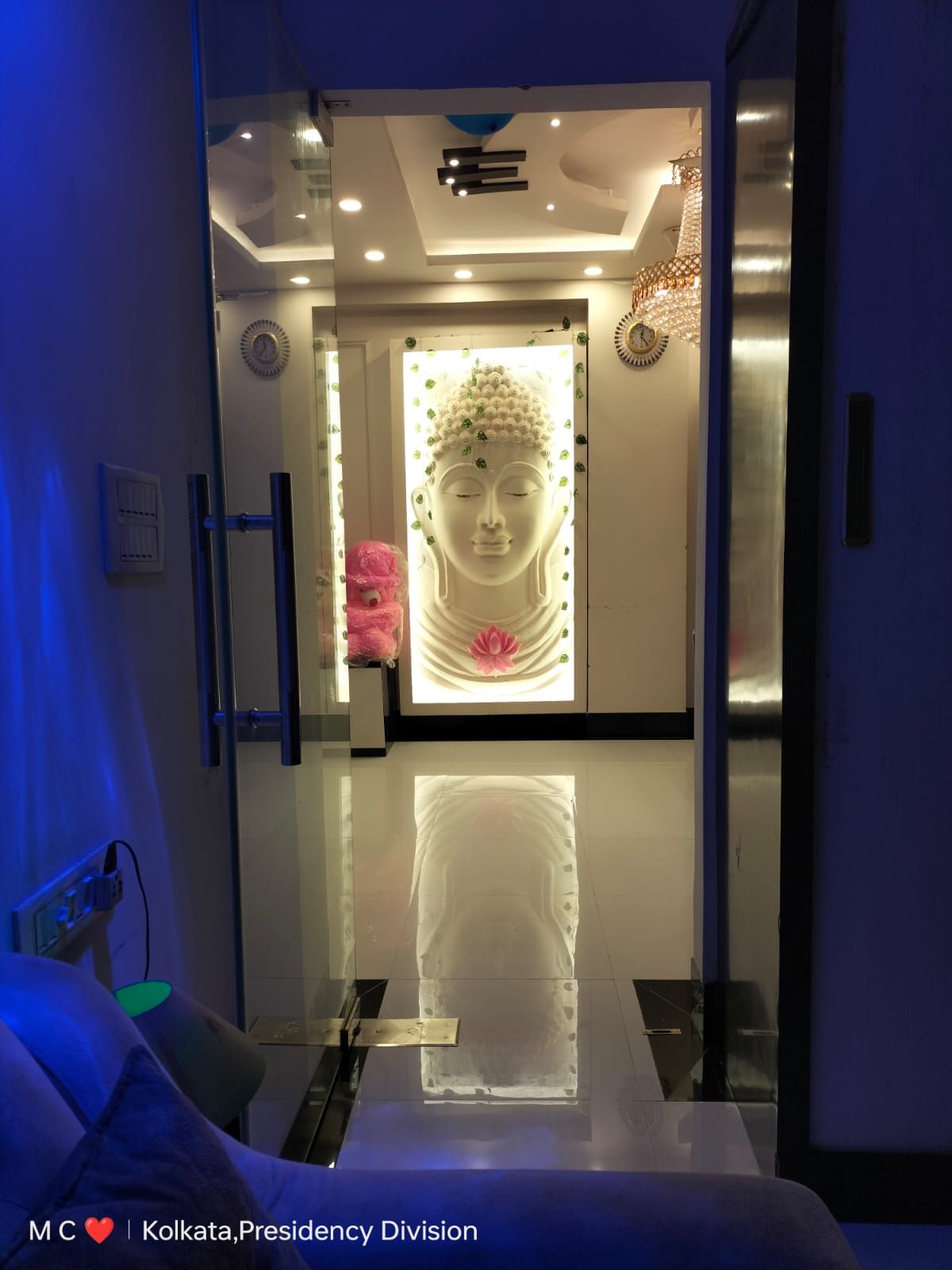 Back-lit Buddha foyer wall
