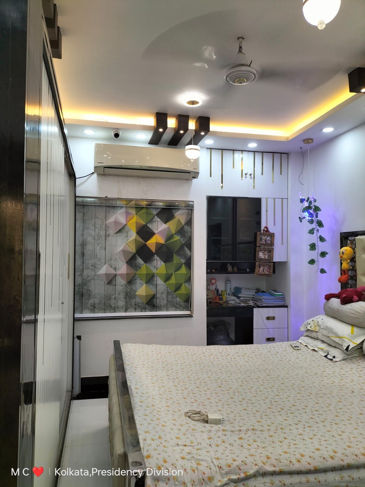 Bedroom with geometric feature wall